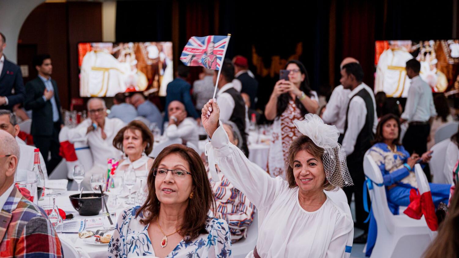 UK expats in Dubai watch the coronation of King Charles III at the Queen Elizabeth 2 ship on Saturday. Photo by Neeraj Murali.