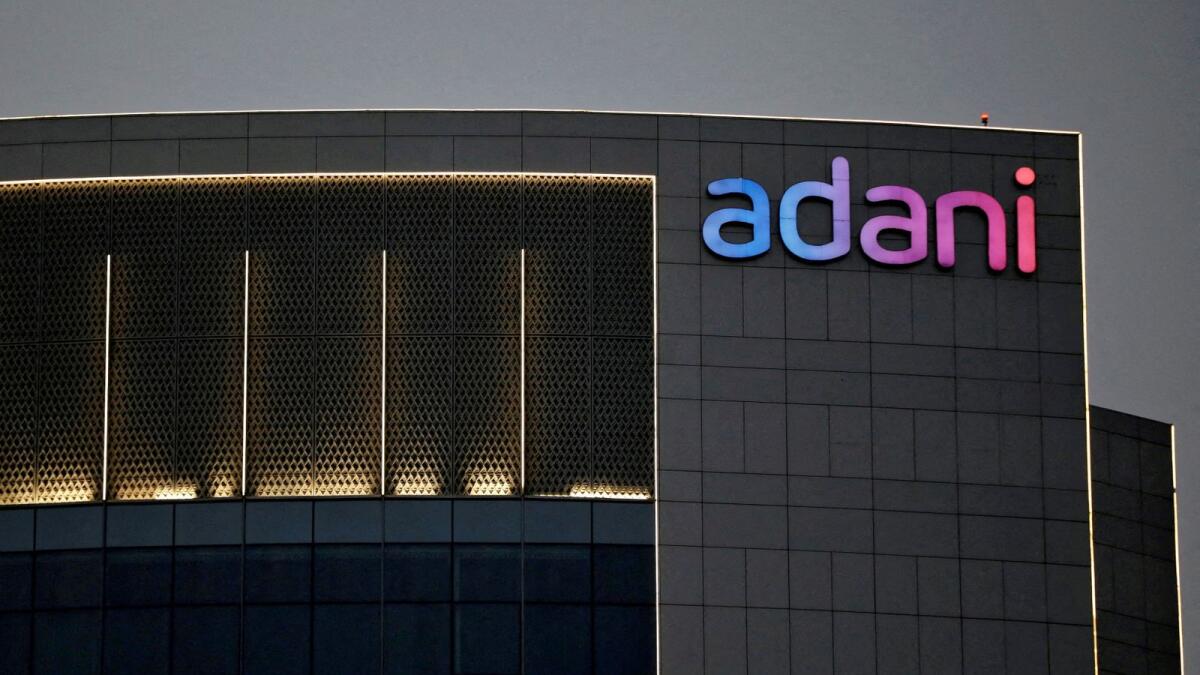 The logo of the Adani group is seen on the facade of one of its buildings on the outskirts of Ahmedabad, India. - Reuters file