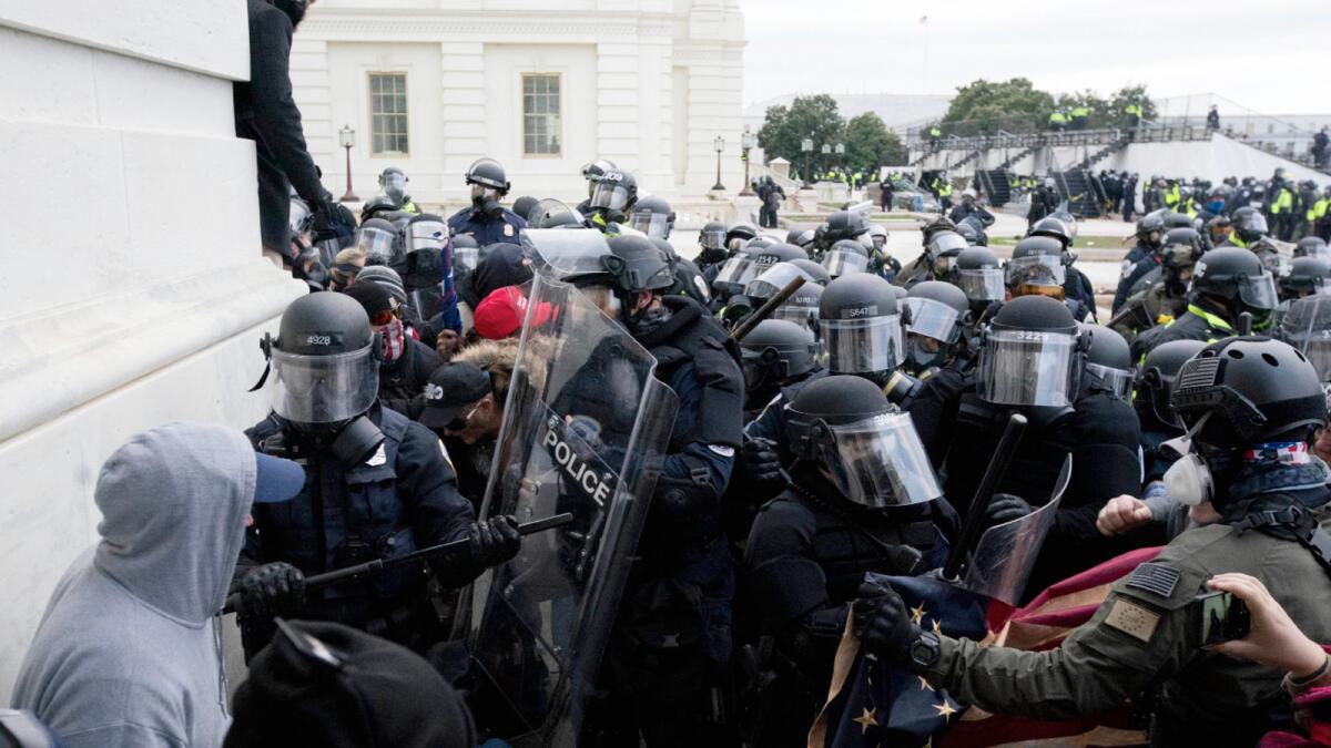 Police push back demonstrators trying to enter the US Capitol. Photo: AP