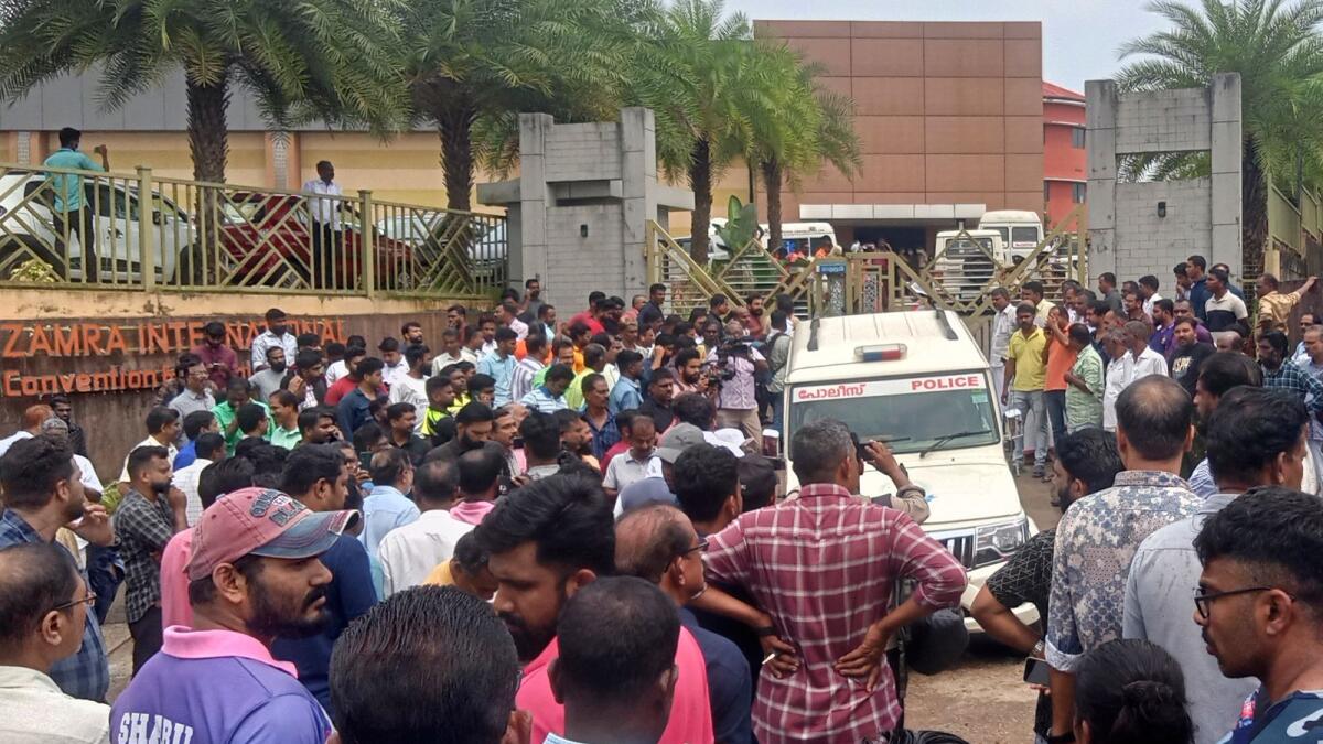 People gather outside after a blast at the Zamra convention center in Kalamassery, India on Sunday, Oct.29, 2023. AP