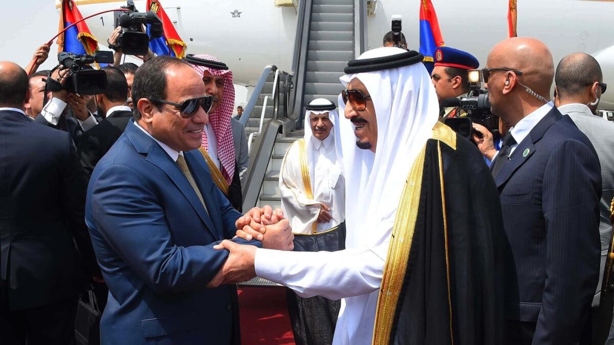 FILE - In this Monday, April 11, 2016 file photo provided by the office of the Egyptian Presidency, Egyptian President Abdel-Fattah el-Sissi, left, shakes hands with Saudi Arabia's King Salman before he departs Egypt. An Egyptian court has rejected as illegal a demarcation border agreement between Egypt and Saudi Arabia under which Cairo would surrender control over two Red Sea islands to Riyadh. (Sherif Abdel Minoem, Egyptian Presidency via AP, File)