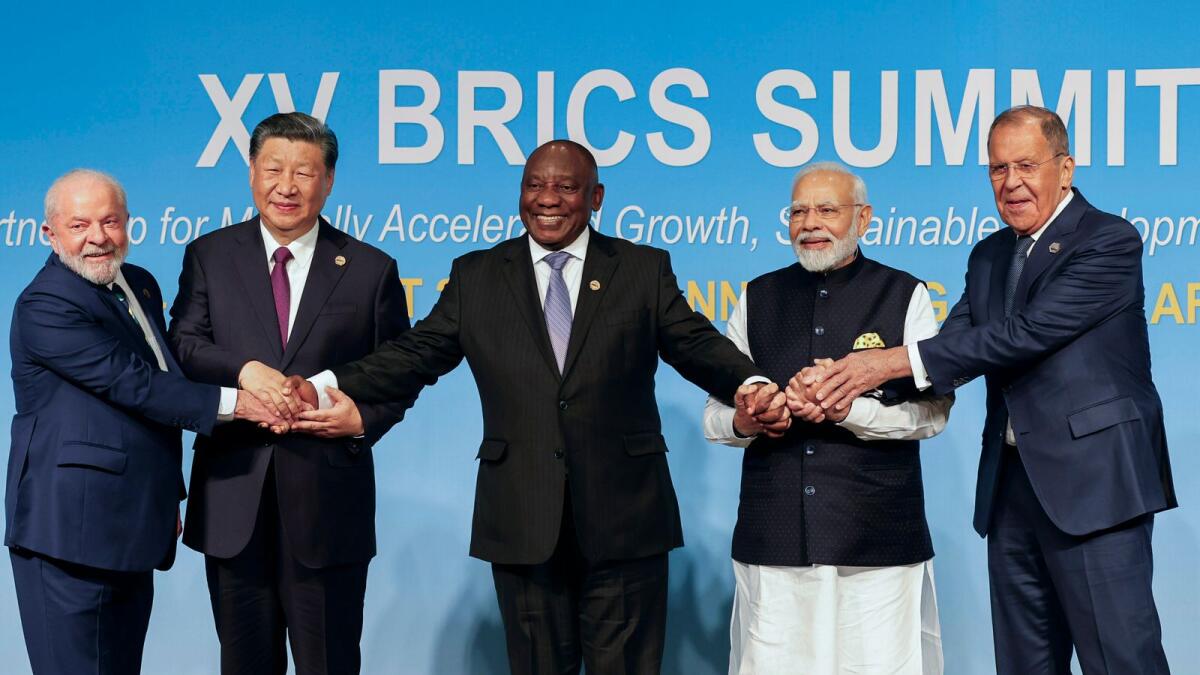From left, Brazil's President Luiz Inacio Lula da Silva, China's President Xi Jinping, South Africa's President Cyril Ramaphosa, India's Prime Minister Narendra Modi and Russia's Foreign Minister Sergei Lavrov pose for a Brics group photo during the 2023 BRICS Summit at the Sandton Convention Centre in Johannesburg, South Africa, on Wednesday. — AP