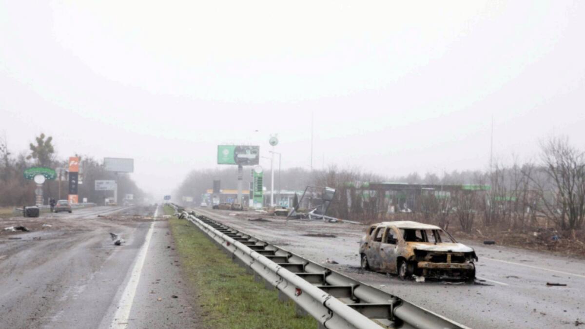 Destroyed cars are seen on a highway 20km from Kyiv. — Reuters