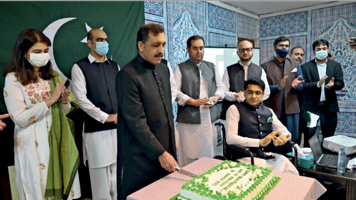 Afzaal Mahmood, Ambassador of Pakistan to the UAE, cuts a cake to mark Pakistan Independence Day, at the embassy in Abu Dhabi. KT Photo/Ryan Lim