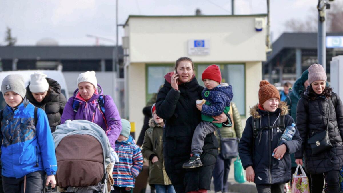 Refugees from Ukraine arrive at the Medyka border crossing in Poland. — AP