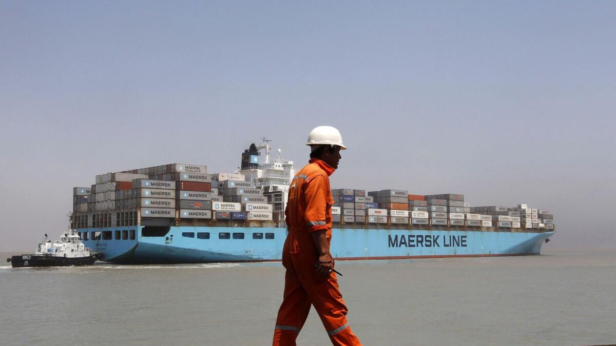 A worker walks past a container ship at Mundra Port in the western Indian state of Gujarat. The digital platform will harmonise vessel, voyage, and cargo-related procedures between the ports on India’s western coast including, Mundra, Kandla, and Nhava Sheva and the UAE including Jebel Ali and Fujairah. — Reuters file