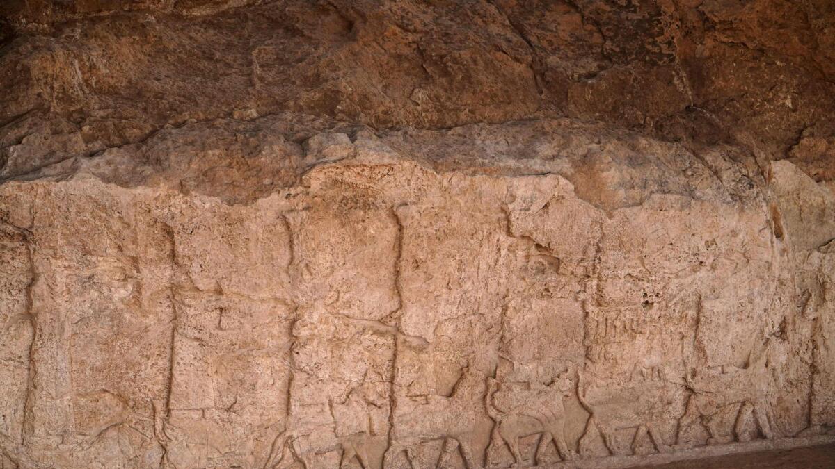 A picture shows a carved plaque lining an ancient irrigation canal dating back to Assyrian times, in the archaeological site of Faydeh (Faida) in the mountains near the town of the same name in the autonomous Kurdish region of Iraq on Sunday. — AFP