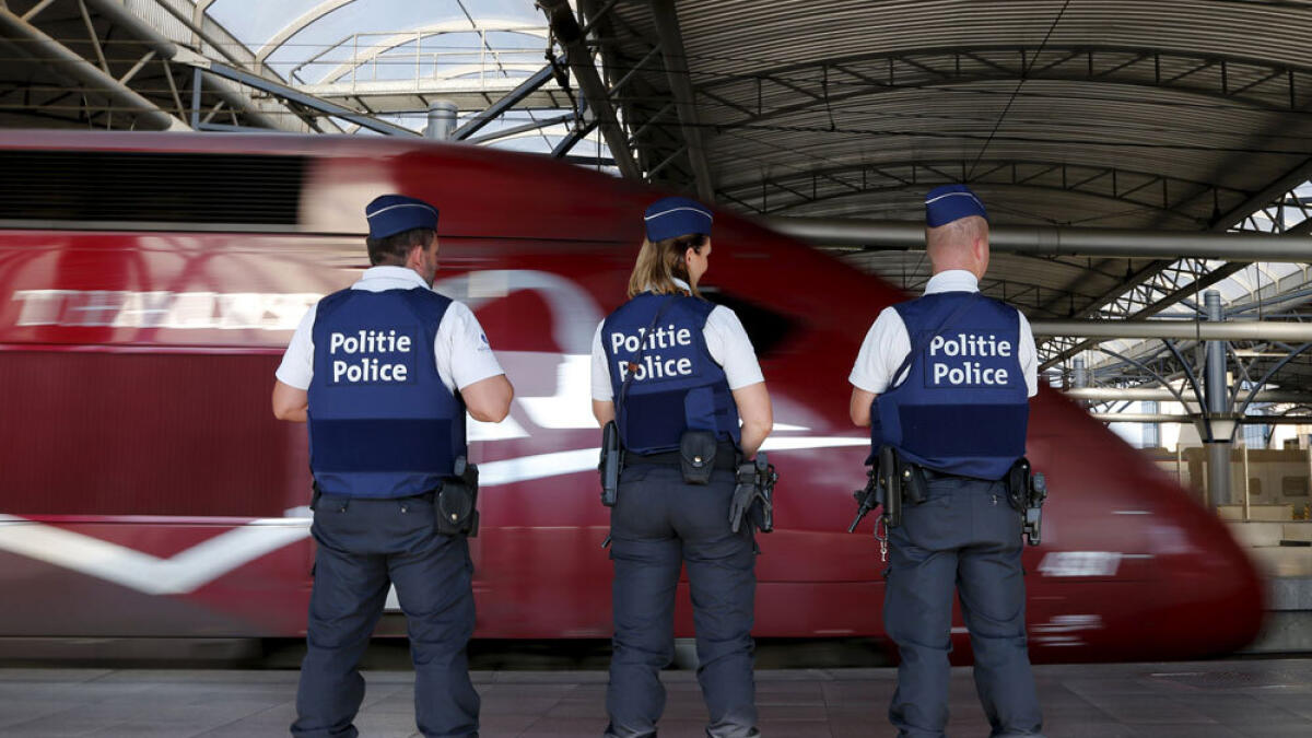 Belgian police officers stand guard on a platform at the Thalys high-speed train terminal at Brussels Midi/Zuid railway station.