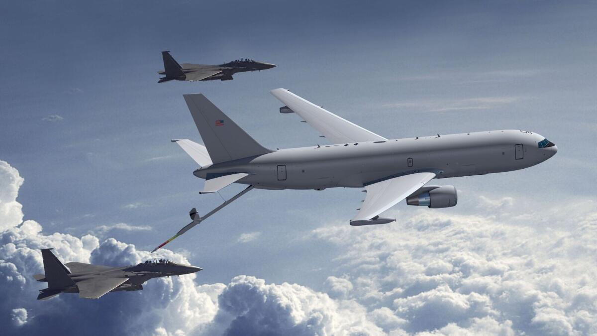 (FILES) This August 3, 2011 Boeing file photo shows a KC-46A tanker refueling F15s.  US aerospace giant Boeing reported lower profits July 22, 2015 and trimmed its full-year forecast following a previously-announced charge on an aerial refueling tanker program for the US Air Force. Earnings for the second quarter fell 32.8 percent to $1.1 billion. Revenues rose 11.3 percent to $24.54 billion. The drop in profits was expected after Boeing announced Friday that it would take a $536 million charge due to higher estimated engineering and manufacturing costs on the KC-46A tanker. Boeing has committed to delivering 18 tankers to the air force by August 2017; a total of 179 tankers is due by 2027.   AFP PHOTO / HANDOUT / BOEING / Chuck Schroder     == RESTRICTED TO EDITORIAL USE / MANDATORY CREDIT: 'AFP PHOTO HANDOUT- The Boeing Company / Chuck Schoeder '/ NO MARKETING - NO ADVERTISING CAMPAIGNS ? NO A LA CARTE SALES / DISTRIBUTED AS A SERVICE TO CLIENTS ==