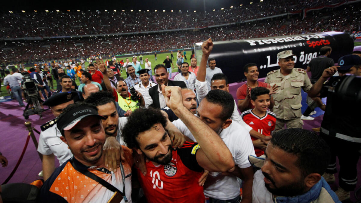 Egypt's Mohamed Salah and team mates celebrate World Cup qualification after the match.