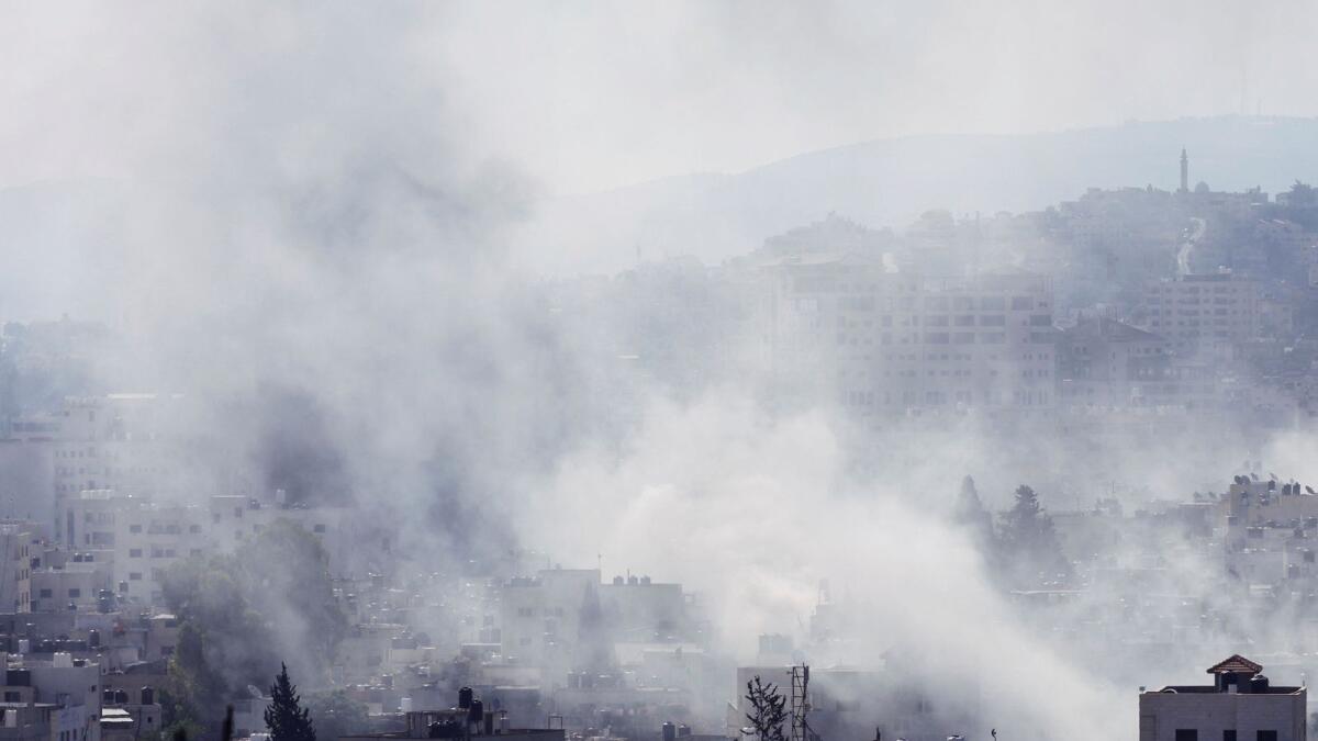 Smoke rises during an Israeli military operation in Jenin, in the Israeli-occupied West Bank, on Monday. __ Reuters