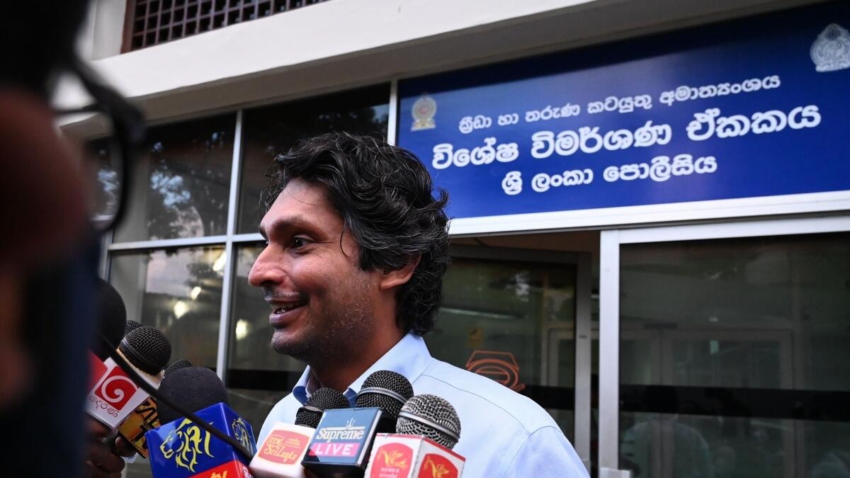 Sri Lanka's cricketer Kumar Sangakkara speaks to the media after questioning by police at the Special Investigation Unit in Colomboai