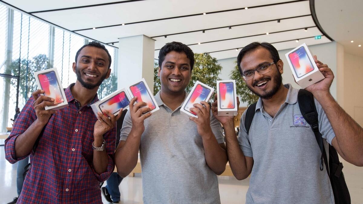 For these fans, one iPhone X isn't enough after patiently waiting for the device at The Dubai Mall Apple Store on Friday.