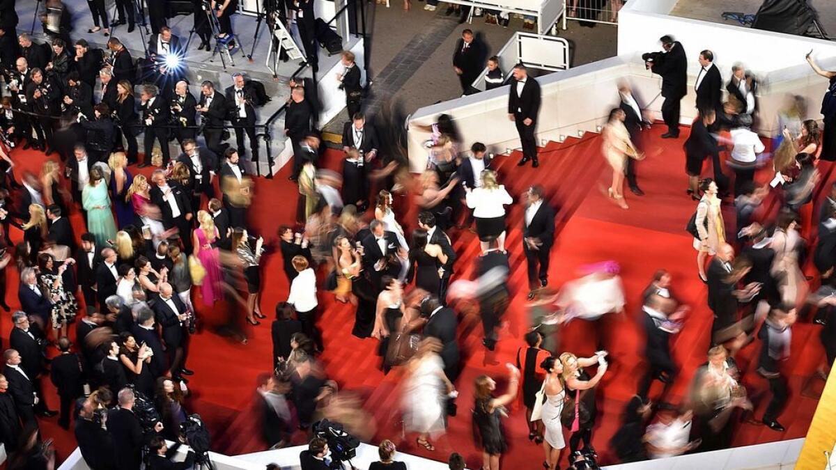 Guests arrive for the screening of the film 'La Danseuse (The Dancer)' at the 69th Cannes Film Festival in Cannes, southern France.