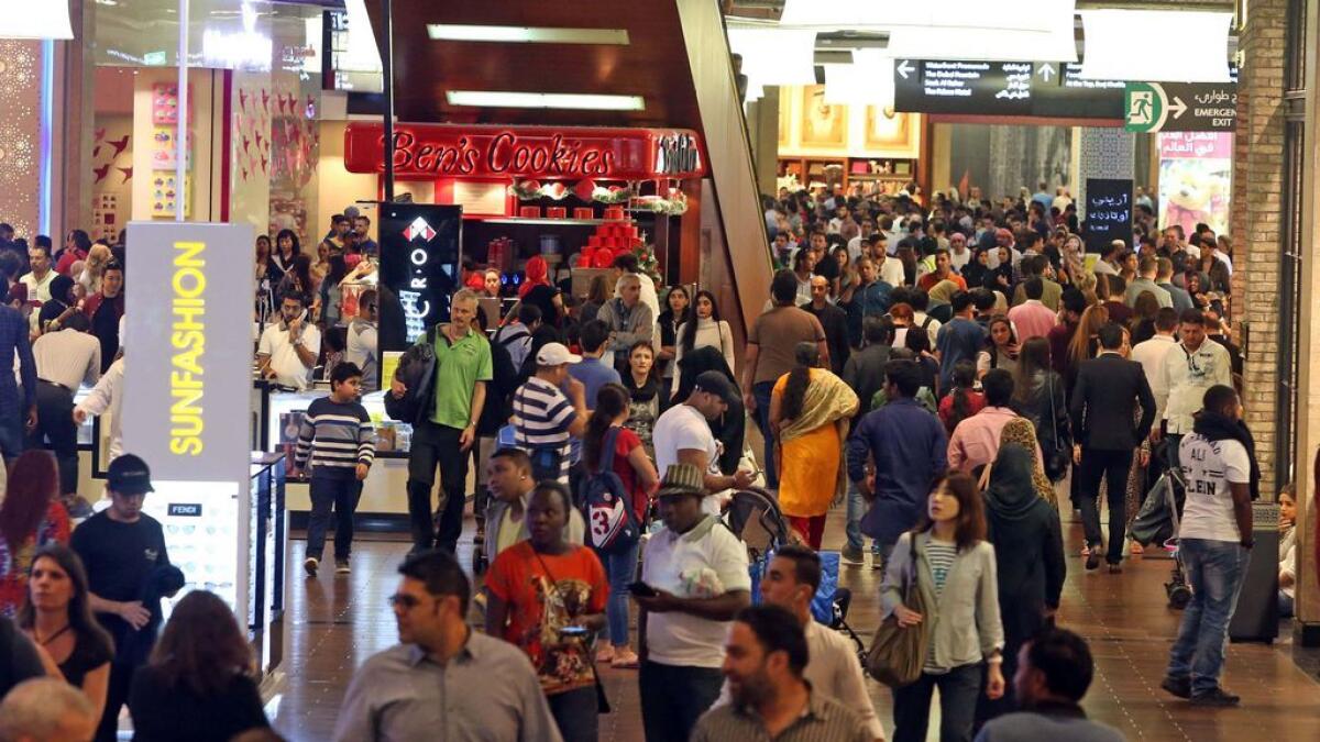 Shoppers at a mall in Dubai. — File photo