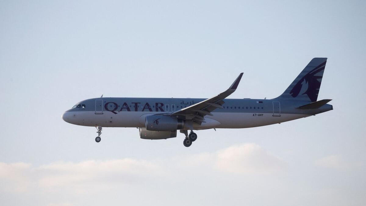 A Qatar Airways plane descends before landing (photo for illustrative purpose). — Reuters file