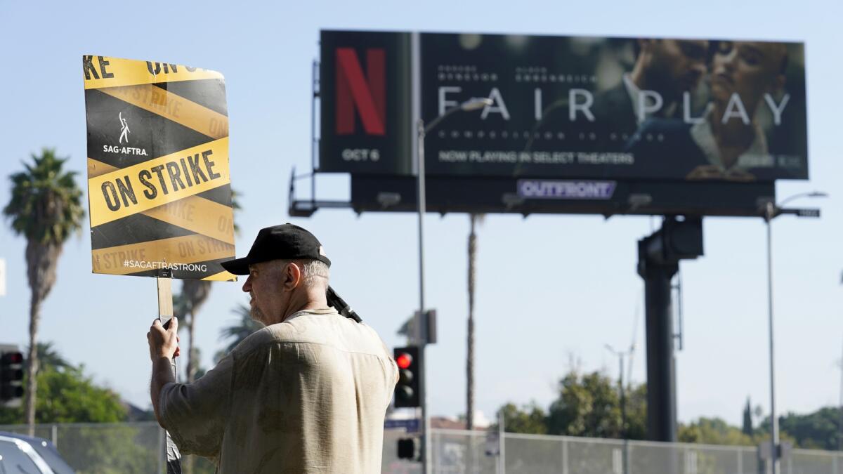 Striking actor Dave Nolan demonstrates outside Netflix studios. — AP