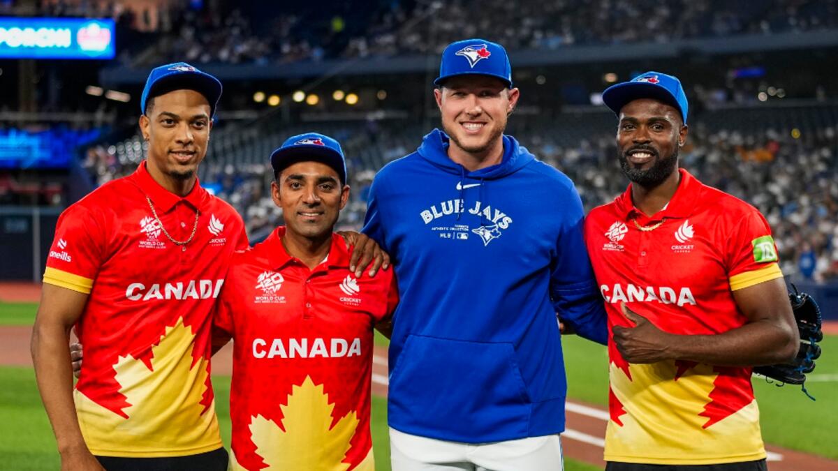 Members of the Canadian cricket team at the Rogers Centre, home of the Blue Jays since 1989, during the unveiling of their new  jerseys. - X
