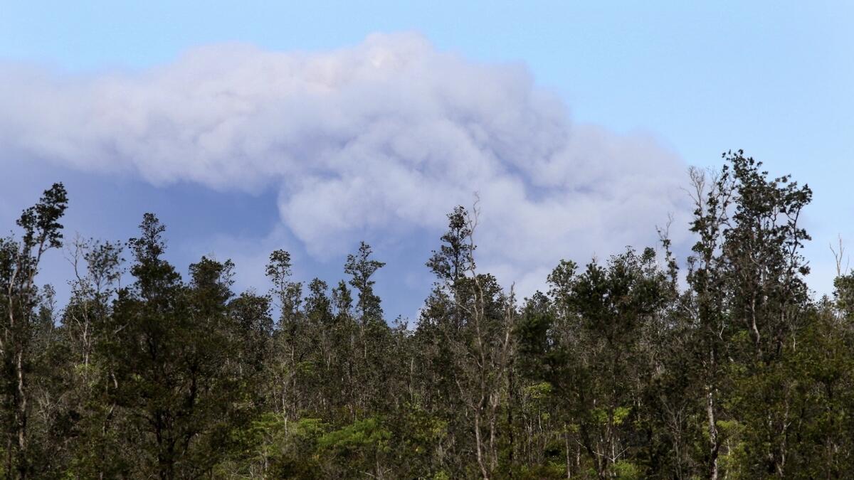 Hawaii volcano erupts from summit, shooting plume of ash