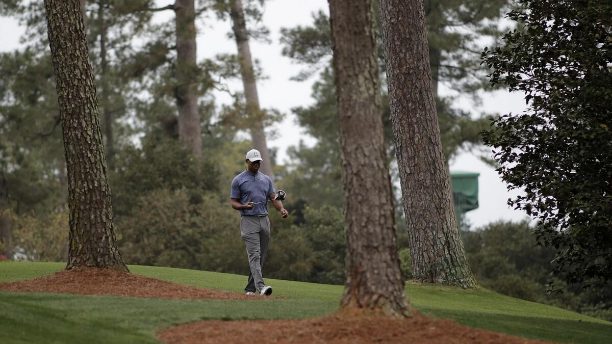 Win, lose or not even here, Woods always in Masters spotlight