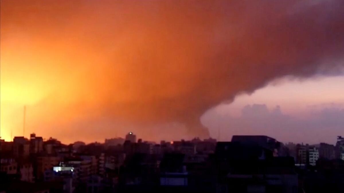 Smoke and flames rise as Israeli air strikes bombard Gaza on Saturday. — Reuters
