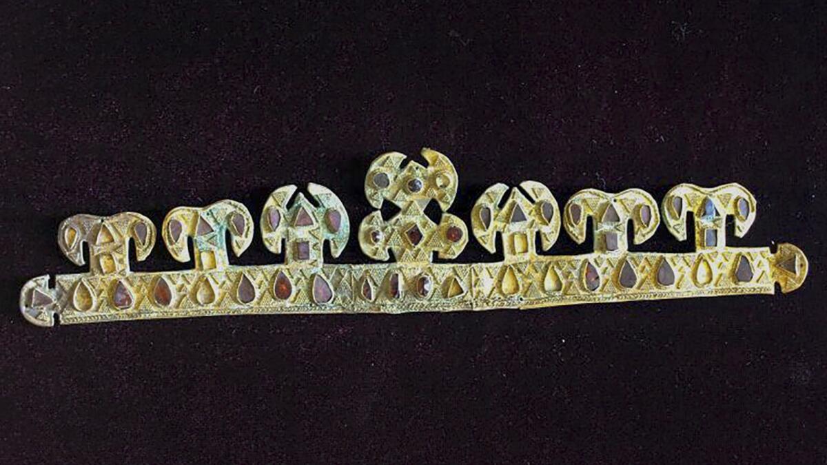 The 1,500 year-old golden tiara, inlaid with precious stones, one of the world's most valuable artifacts from the blood-letting rule of Attila the Hun, is seen in a museum in Melitopol, Ukraine, in November 2020. Russian troops stole and carted away the priceless crown and a hoard of other treasures after capturing the Ukrainian city of Melitopol in February.