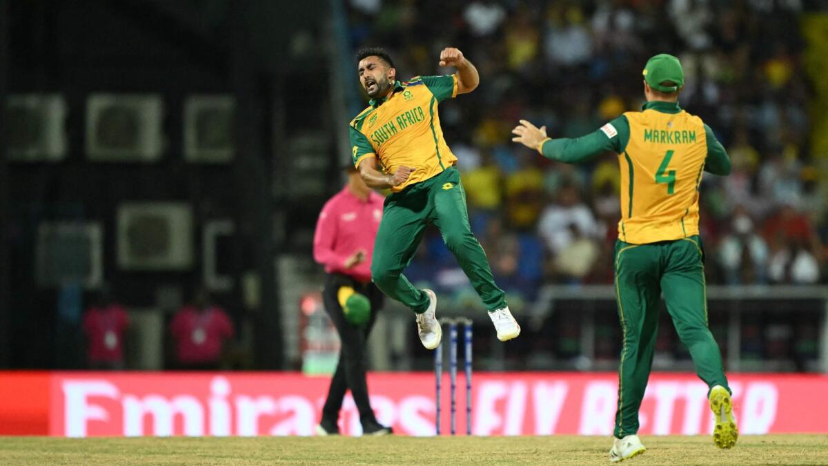 South Africa's Tabraiz Shamsi (left) and Aiden Markram celebrate the dismissal of West Indies' Sherfane Rutherford. — AFP