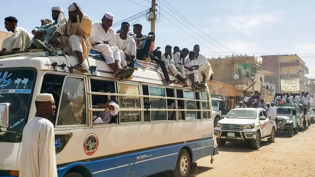 People form a convoy as they celebrate in support of the Sudanese armed forces in Khartoum. — AFP