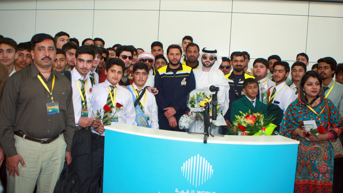 NA040216-CHILDREN- Pakistani Cricketer Shahid Afridi welcoming the children from Army Public School in Peshawar at Dubai International Airport on Thursday, 04 February 2016.  Photo by Mohammad Mustafa Khan