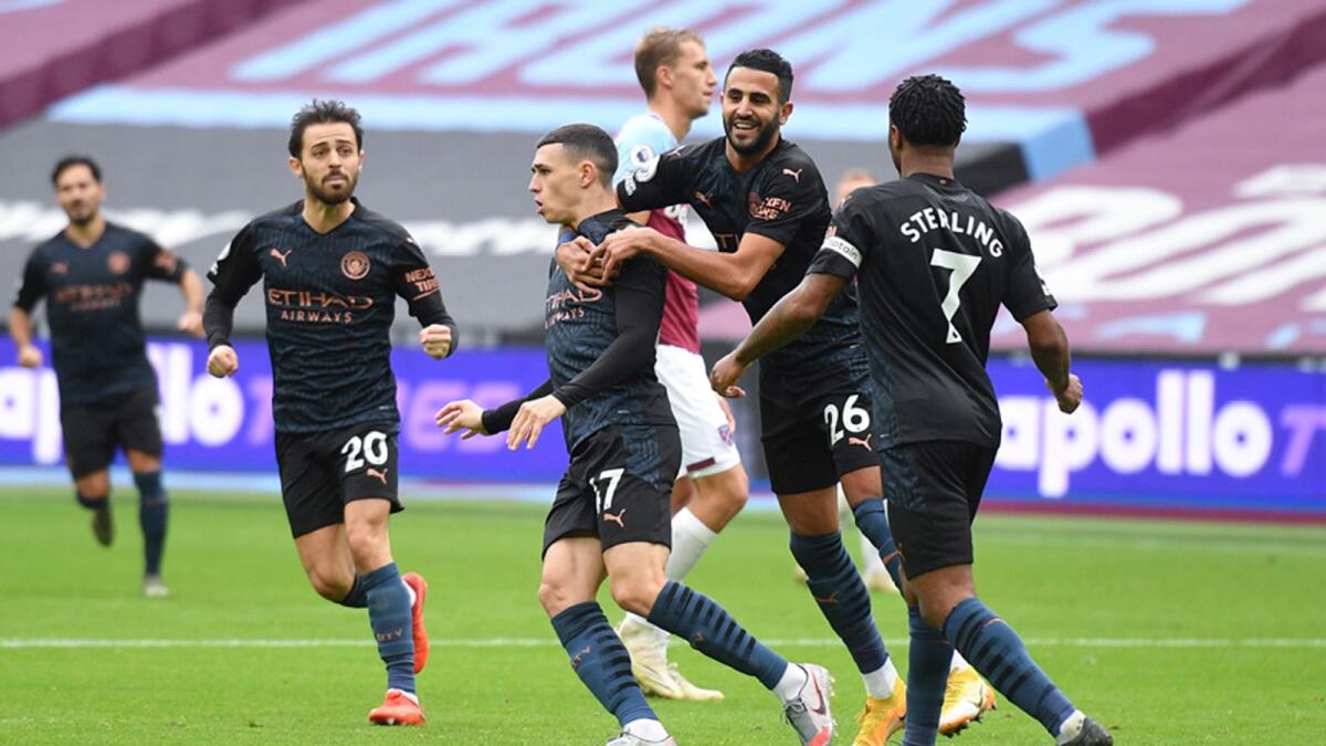 Phil Foden (third from left) celebrates after scoring Manchester United's equaliser during the English Premier League match against West Ham. — AP