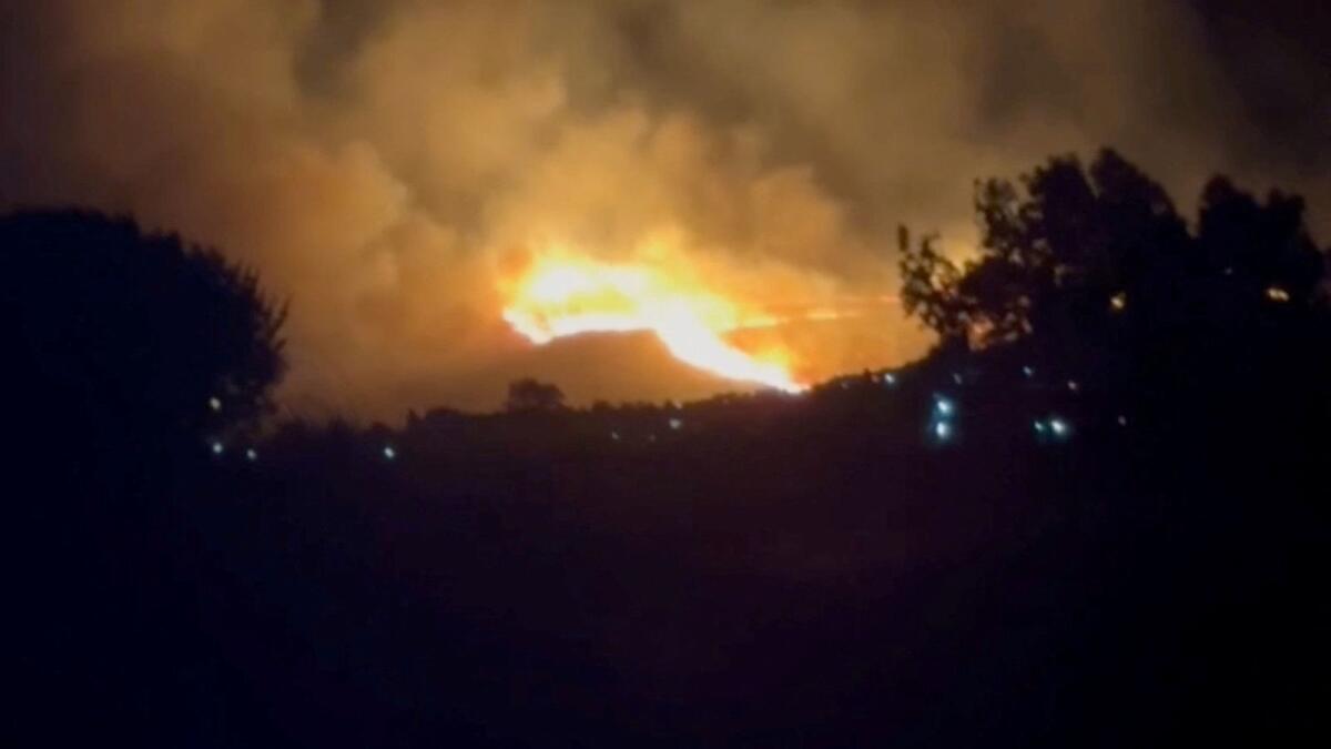 A view of fire around the island of Kos, Greece, on Monday in this screen grab obtained from a social media video. — Reuters