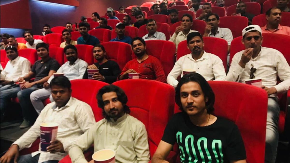 Over 200 blue-collar workers treated to VIP movie screening