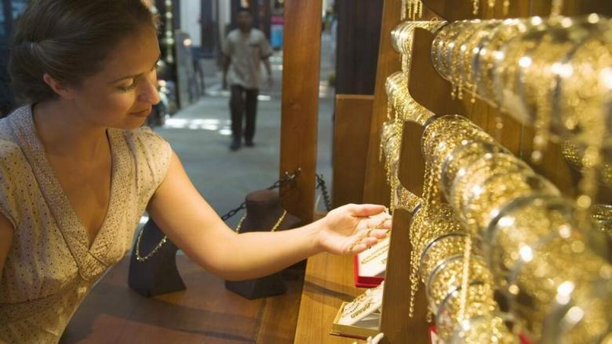 Gold eases on receding trade fears