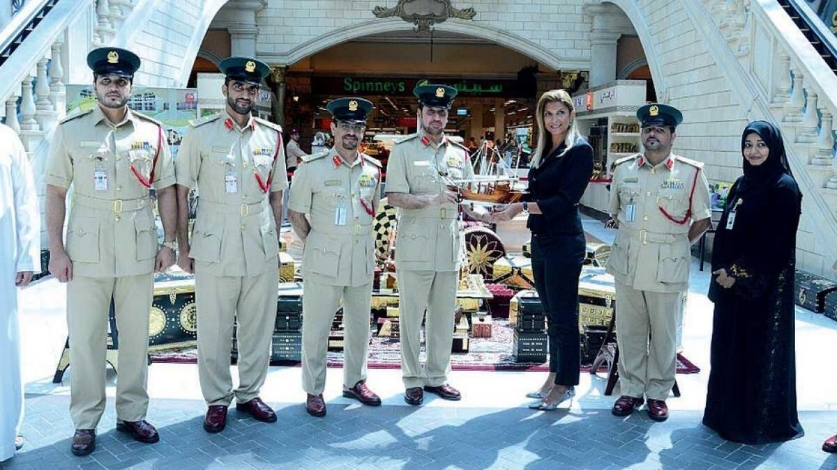 Officials from the Dubai Police and Mercato Mall at the Inmates Products Exhibition. — Supplied photo