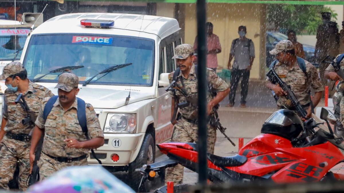 Shahrukh Saifi, an accused in the Kerala train attack case, is escorted by police personnel during a visit to a medical college for check-up in Kozhikode on Friday. — PTI