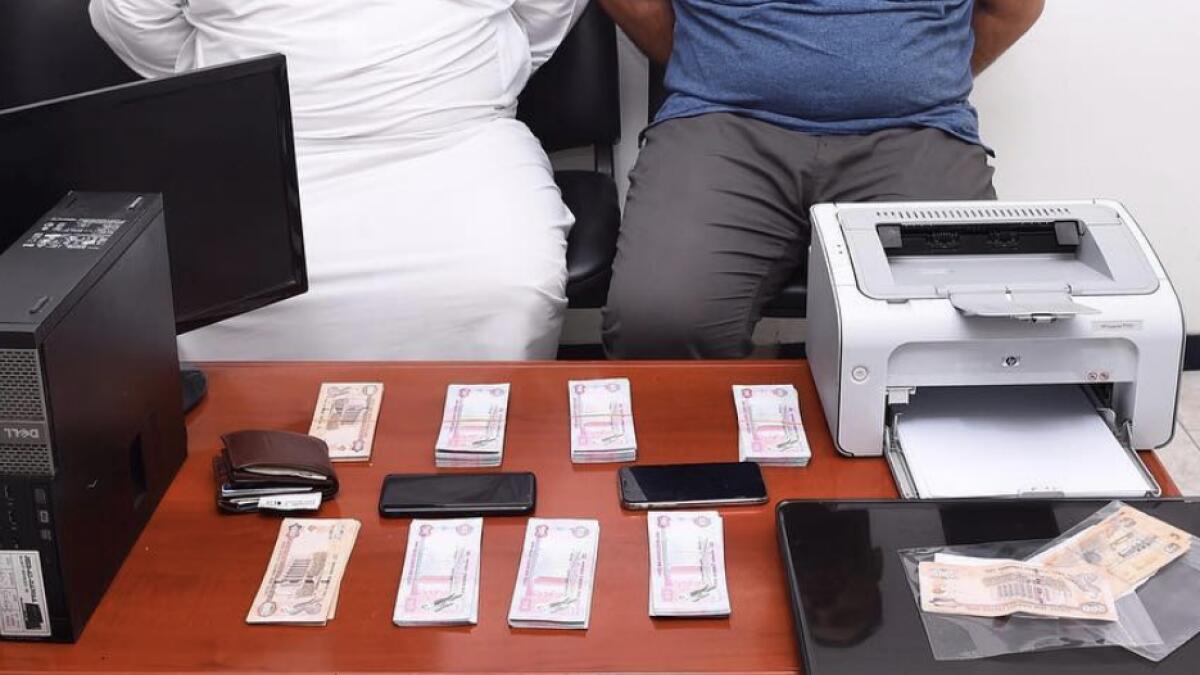2 UAE expats caught with fake currency worth Dh45,500