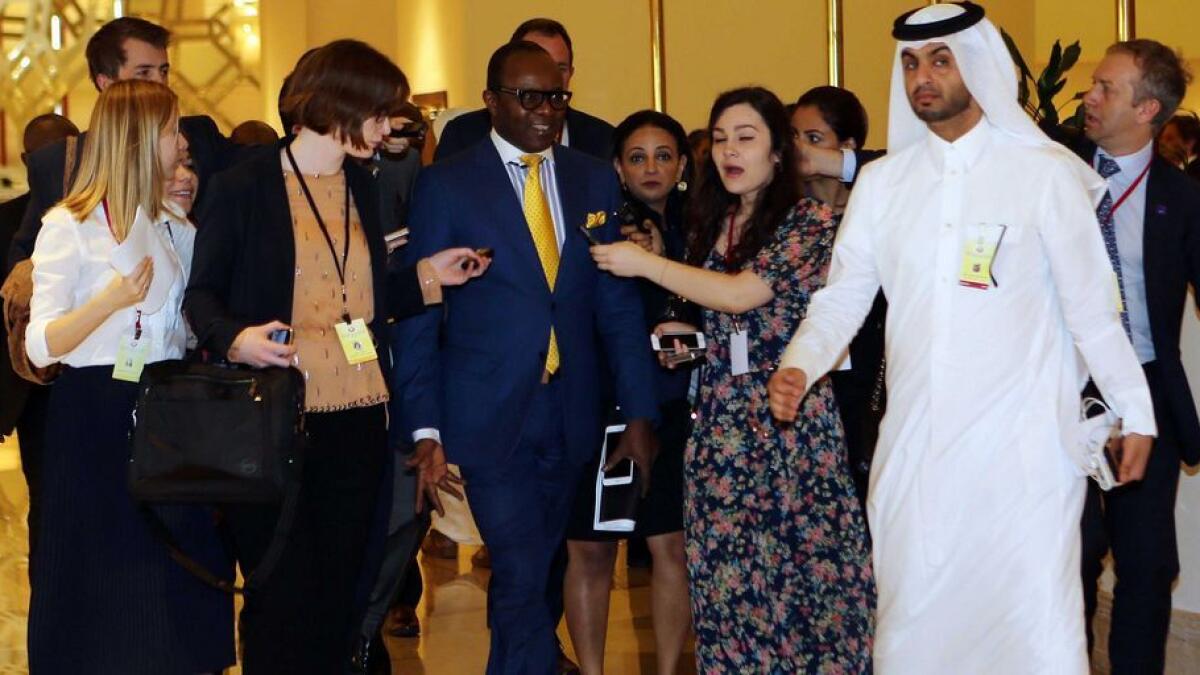 Nigerian oil minister Emmanuel Ibe Kachikwu (C) arrives for the organization of Petroleum Exporting Countries (OPEC) meeting, in the Qatari capital Doha.  