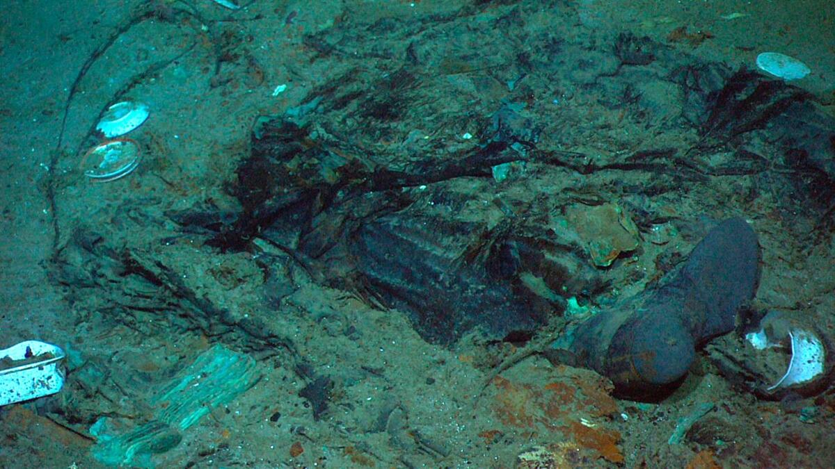 This 2004 photo shows the remains of a coat and boots in the mud on the sea bed near the Titanic's stern. (Institute for Exploration, Center for Archaeological Oceanography/University of Rhode Island/NOAA Office of Ocean Exploration)