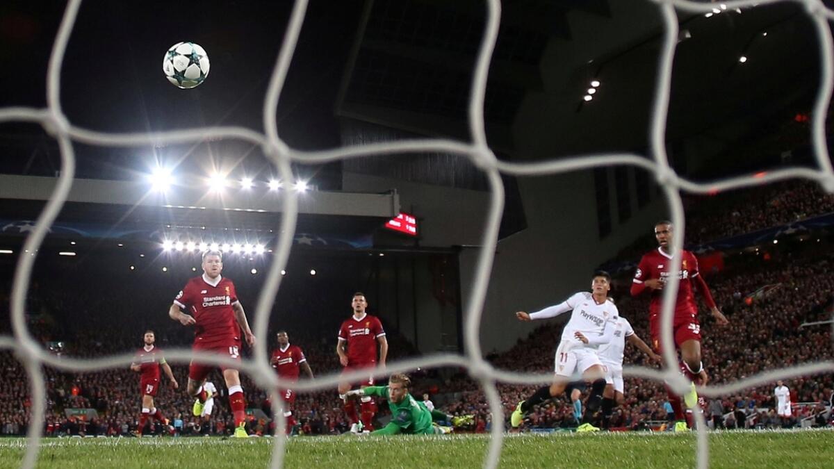 Sevilla’s Joaquin Correa scores their second goal against Liverpool in the UEFA Champions League match on Wednesday.