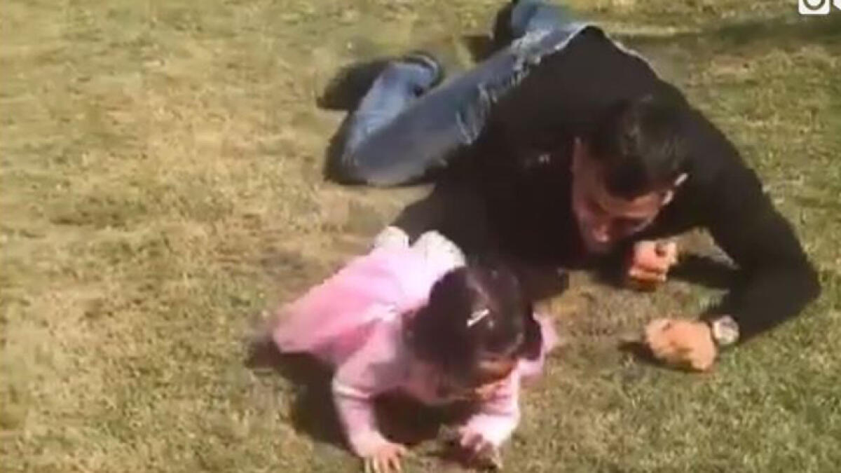 Watch: Dhonis video crawling with daughter is winning the internet