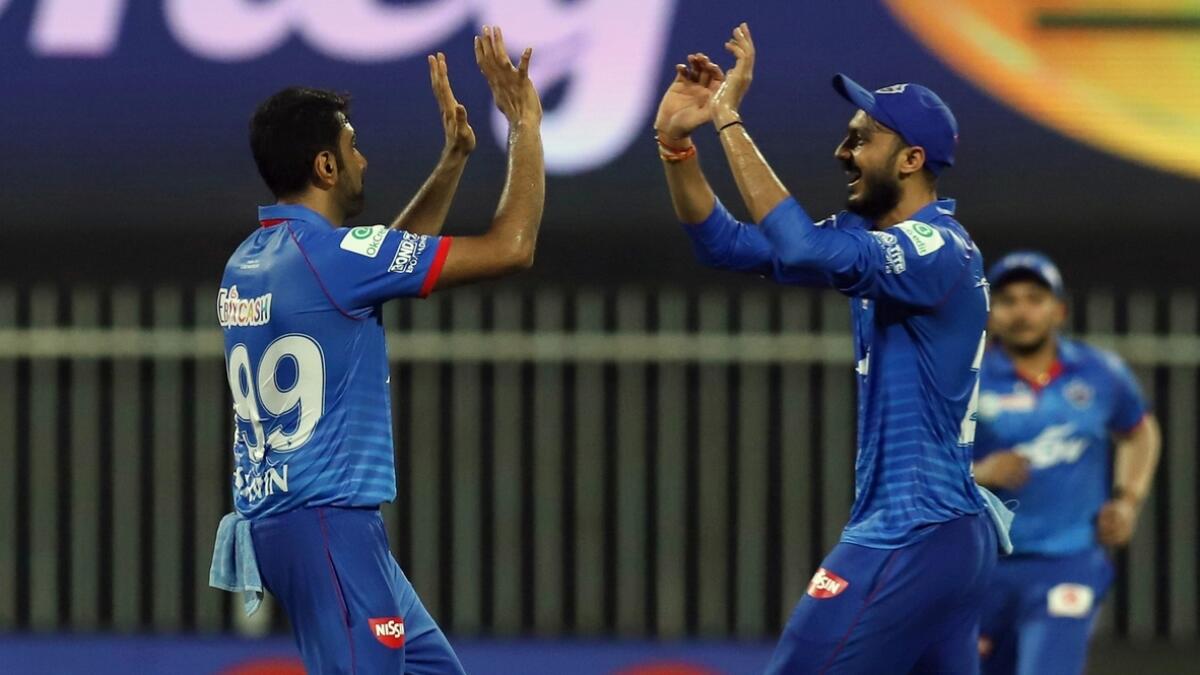 Axar Patel and R Ashwin of Delhi Capitals celebrate Buttler's wicket