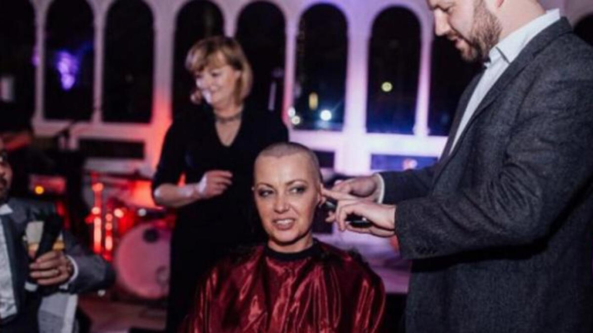 Tribute to husband with cancer: Bride shaves her head on wedding day