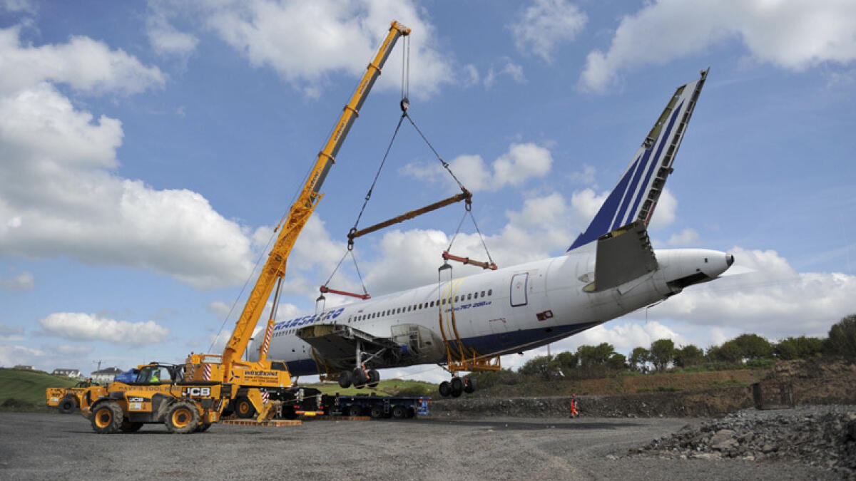 A Boeing 767 airplane is lifted into the air in a specially manufactured cradle to be placed in it's final destination in Enniscrone Village. - Reuters