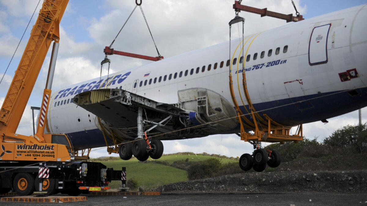 A Boeing 767 airplane is lifted into the air in a specially manufactured cradle to be placed in it's final destination in Enniscrone Village. Reuters