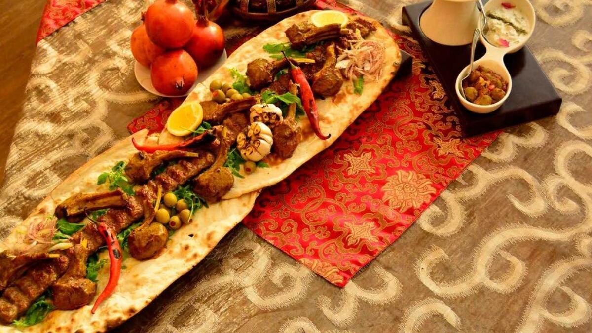 Carnivore's delight: The metre-long Lamb Bonanza (above) comes with Kebab Kubideh, lamb chops and tikkas; Shayan (inset) offers majlis-style seating for large groups