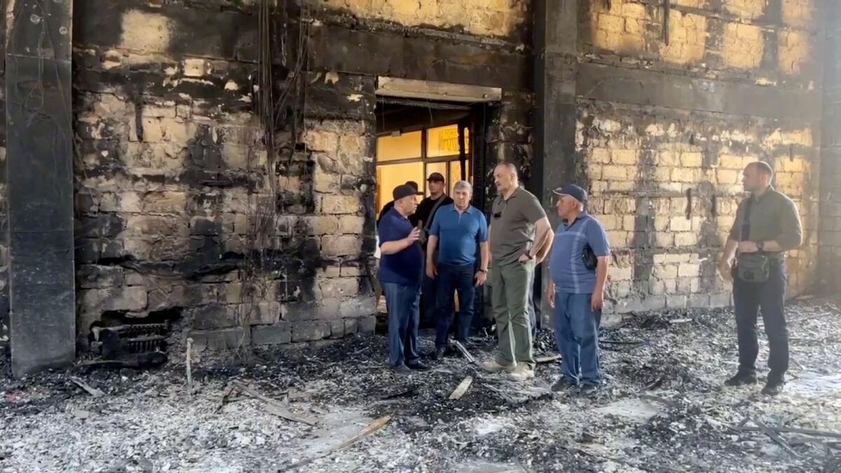Sergei Melikov, the head of the Dagestan region, visits Derbent synagogue following an attack by gunmen and a fire on June 24, 2024, in this still image taken from video.  — Reuters file