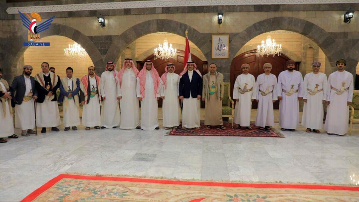 In this handout photo released on April 9, 2023 by the Houthi group’s media arm, Saudi, Yemen and Omani delegates pose for a photo in Sanaa, Yemen.