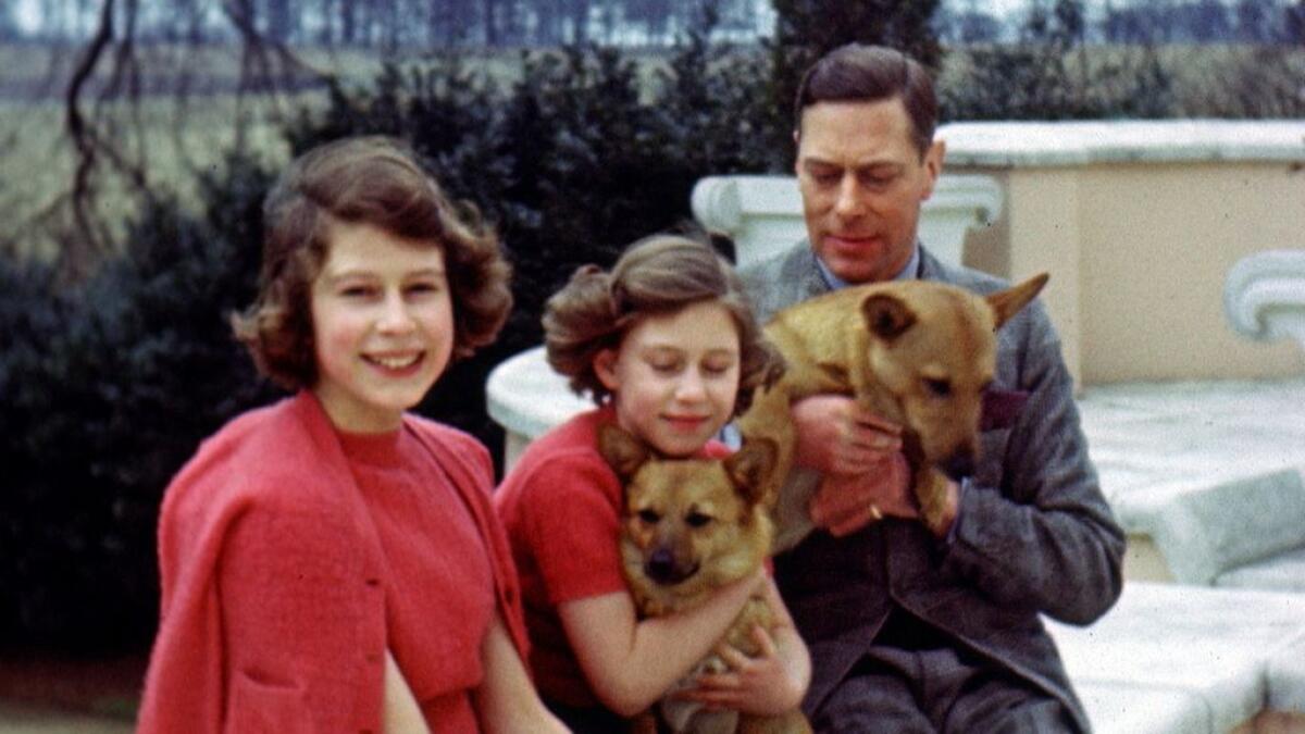Britains Queen Elizabeth is seen while still Princess Elizabeth (L), with her father King George VI and her sister Princess Margaret, in this undated still image taken from footage, released by Buckingham Palace in London, Britain