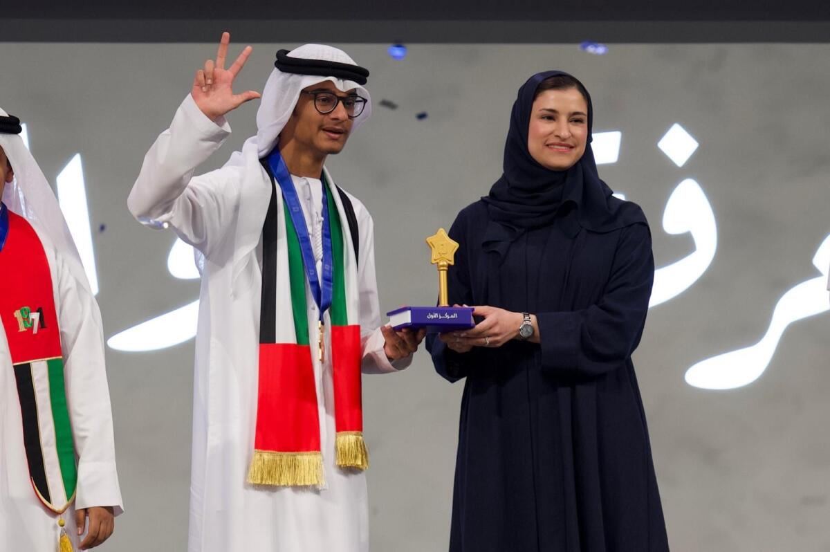Ahmed Faisal Ali with Sarah bint Yousef Al Amiri, Minister of State for Public Education and Advanced Technology. KT Photo: Neeraj Murali