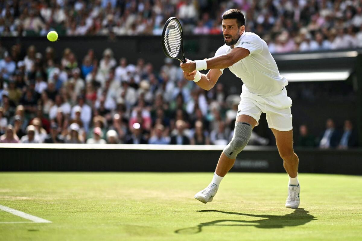 Novak Djokovic hits a backhand return during his match against Jacob Feamley. — AFP